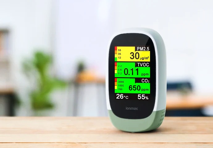 Indoor Air Quality Monitor with 10-in-1 Detection device are on table and showing values digitally 