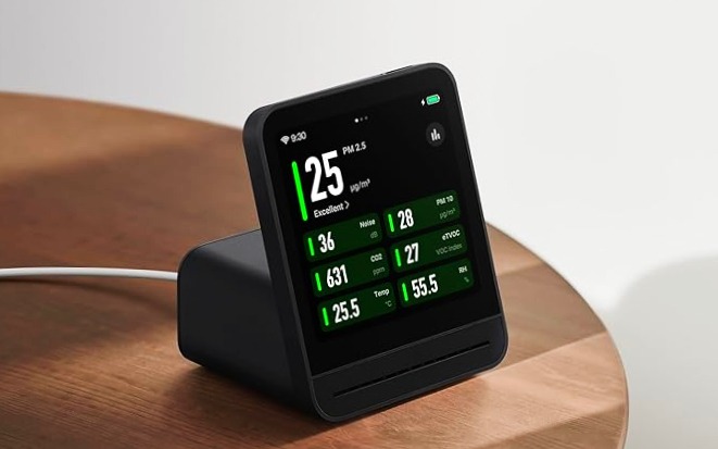 Bonoch 16-in-1 Indoor Air Quality Monitor with Alerts and device and laying on table with its wire 