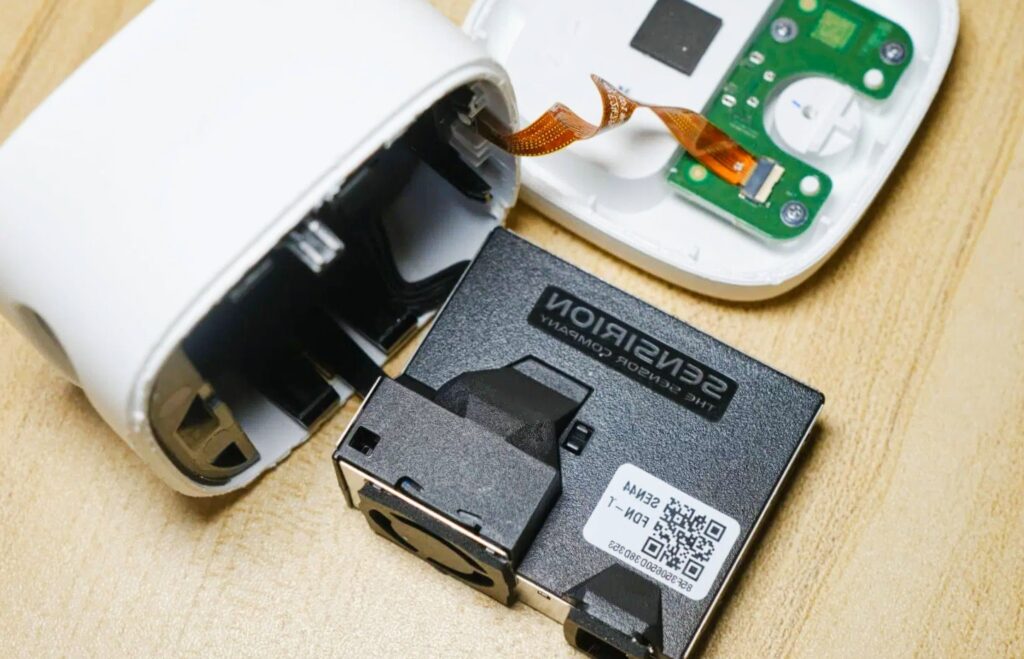 Amazon Smart Air Quality Monitor device are operated and on table it's components also there 