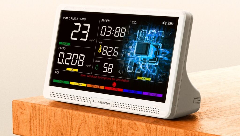 16-in-1 Indoor Air Quality Monitor with Display device are lying on table its showing its values on displaying screen 